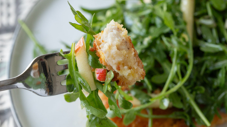 piece of breaded chicken on a fork