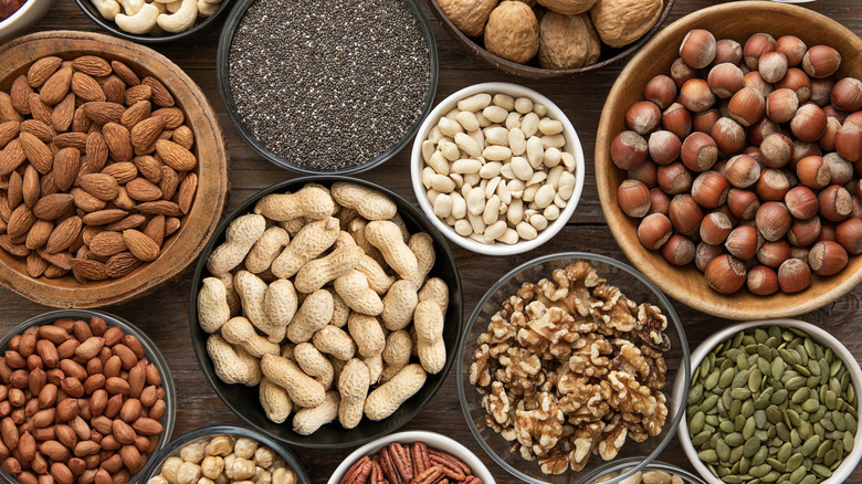 Variety of mixed nuts on wooden table