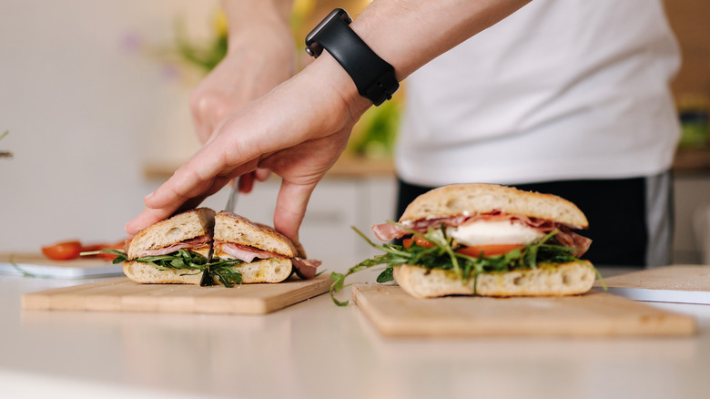 Man cutting sandwich 