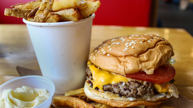 Five Guys French fries in a white cup with burger