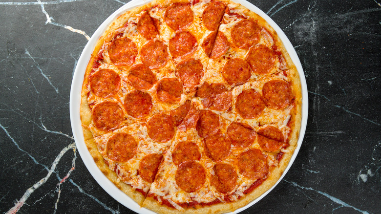 Pepperoni pizza on marble countertop