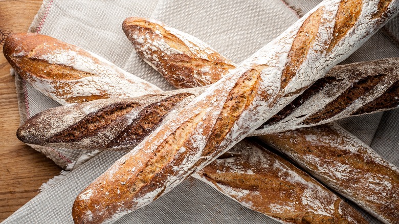 four baguettes on table