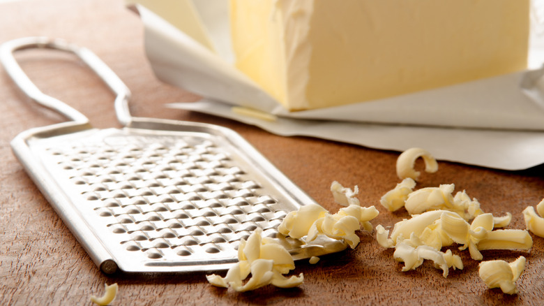 Grated butter next to a grater