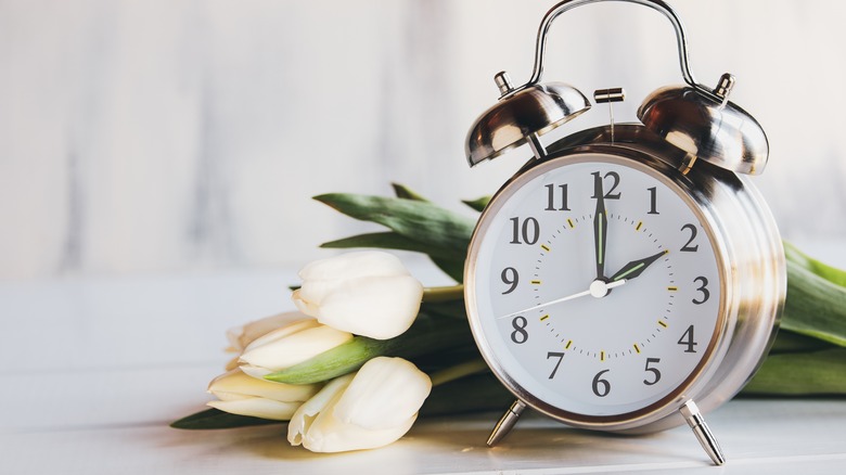 Clock with white flowers