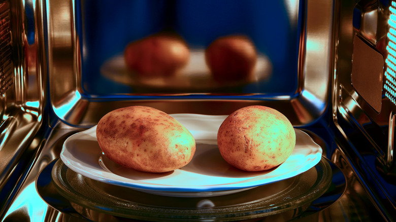 Whole potatoes in a microwave