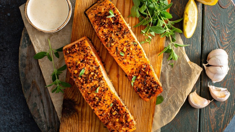 two pieces of cedar plank salmon