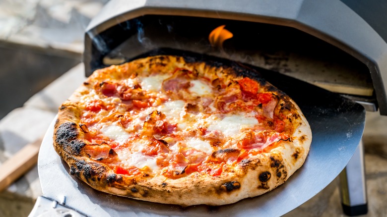homemade pizza in pizza oven