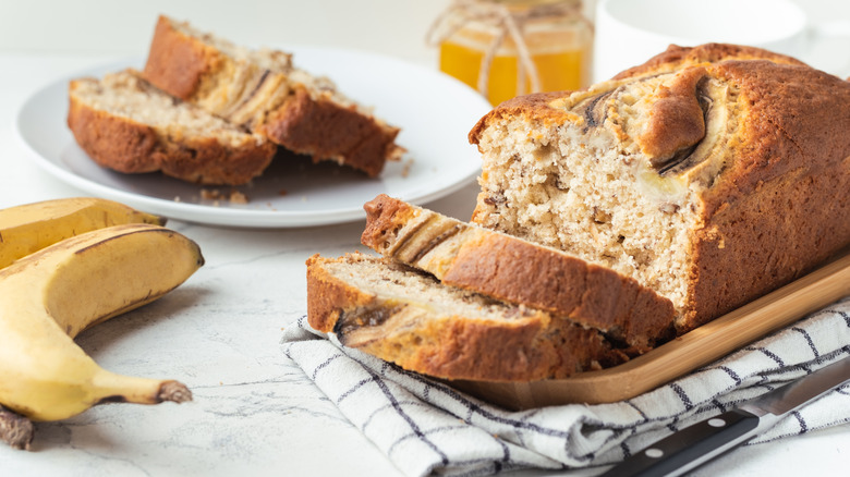 Banana bread loaf on a brown board