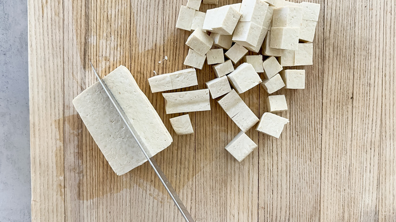 tofu cubed on cutting board