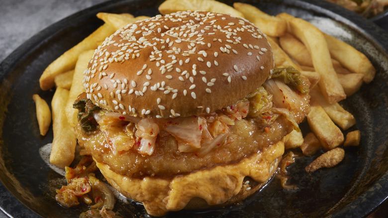Chicken burger topped with kimchi