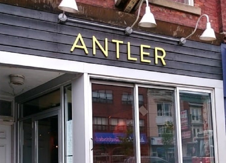 antler co-owner carves deer in front of vegan protestors