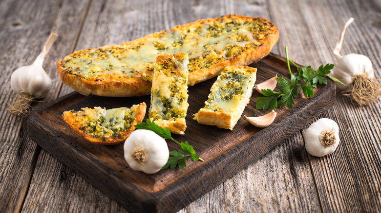 Garlic bread on wooden board