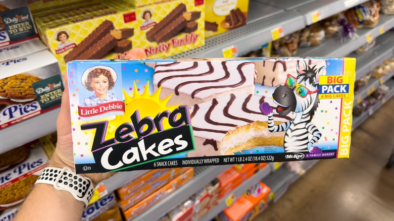 Person holding Little Debbie Zebra Cakes