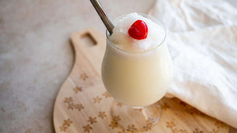 pina colada with cherry garnish