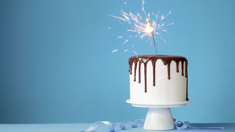 cake with sparklers lit up