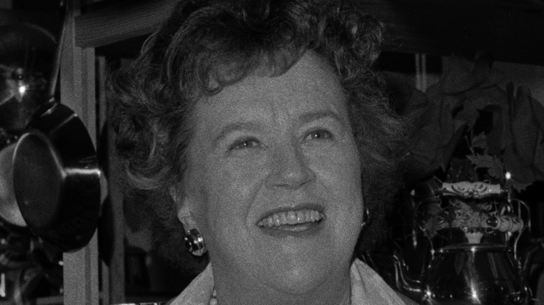 Julia Child smiling in black and white