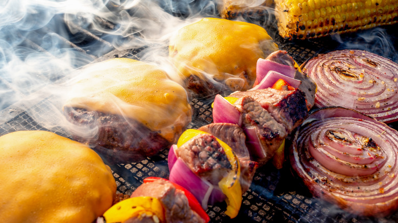 smoke coming off food on the grill