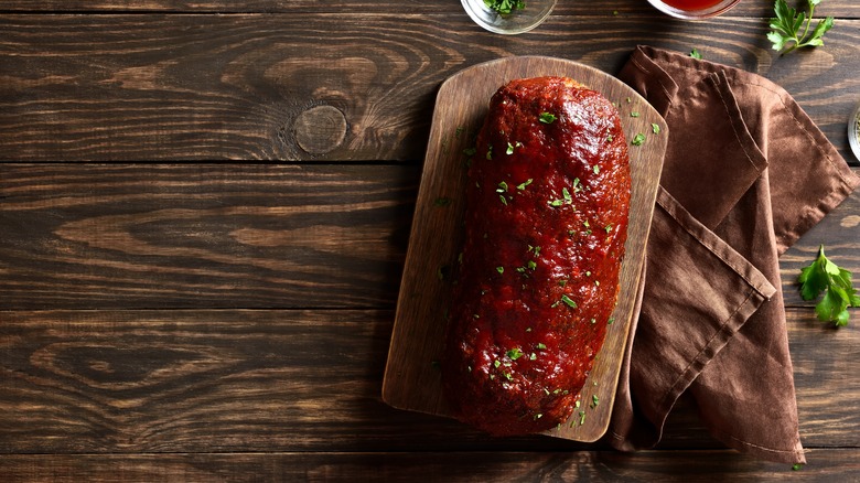 Whole meatloaf on a cutting board