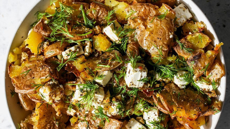 Smashed potato salad with herbs