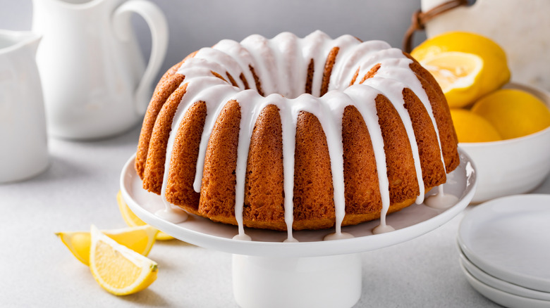 Lemon bundt cake on cake plate.
