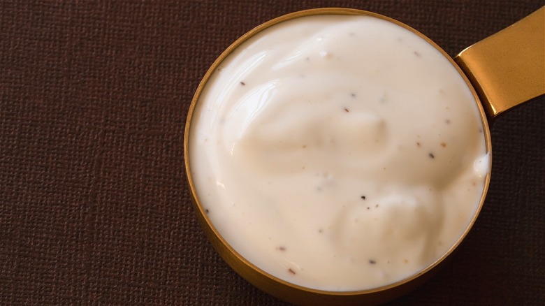 Ranch dressing in measuring cup