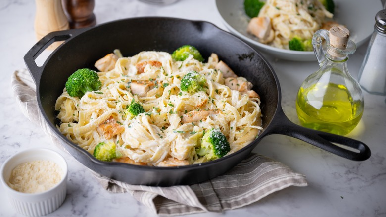 Fettuccini Alfredo in skillet with broccoli