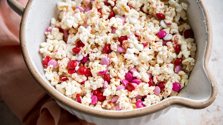 pink and red popcorn in bowl