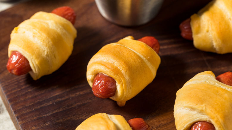 Pigs in a blanket on a wooden board