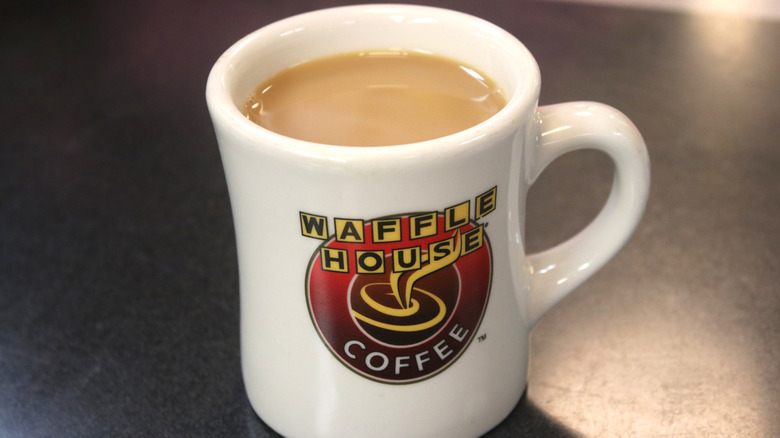 Coffee lightened with cream in a white Waffle House branded mug