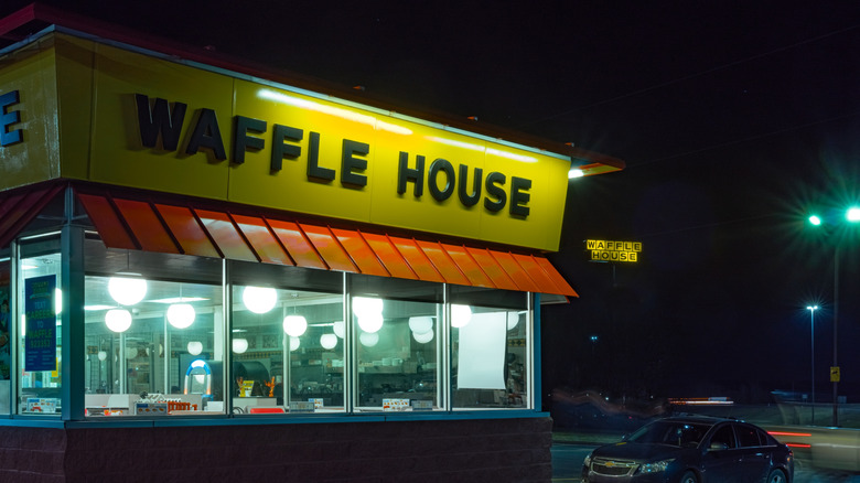 The exterior of a Waffle House at night