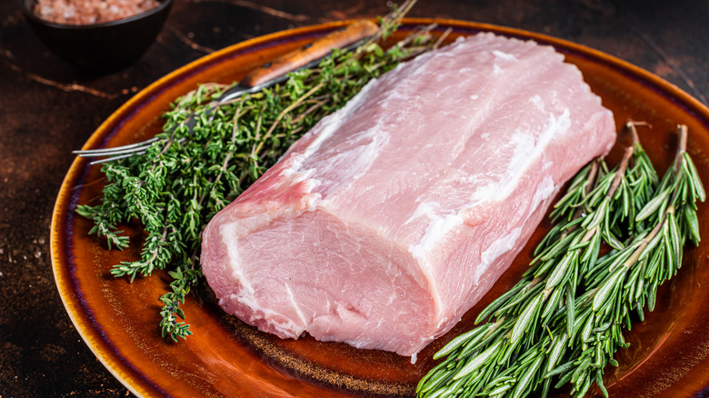 whole pork loin uncooked with herbs