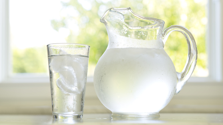ice water and pitcher of cold water window background