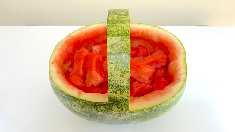 Watermelon basket filled with balls and dog biscuit shapes