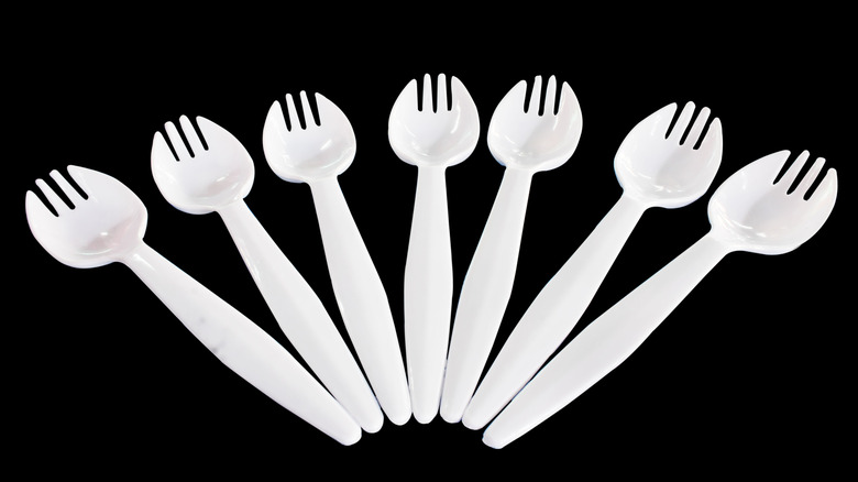 white sporks on black background
