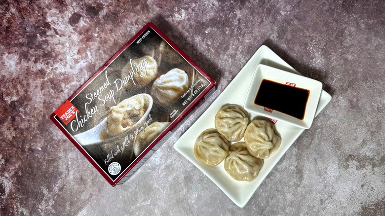 A box and plate of Trader Joe's Steamed Chicken Soup Dumplings