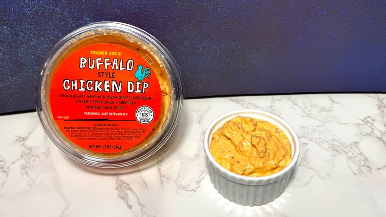 Package and cup of Trader Joe's Buffalo Style Chicken Dip