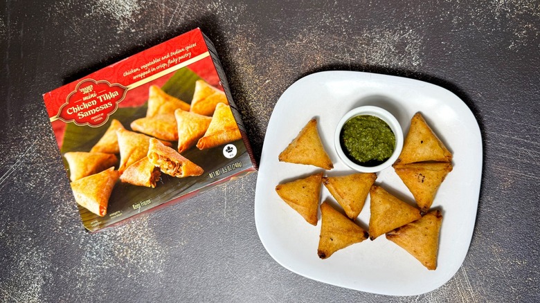 A box and plate of Trader Joe's Mini Chicken Tikka Samosas