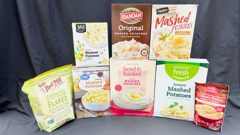 Eight boxes of instant mashed potatoes on a black background