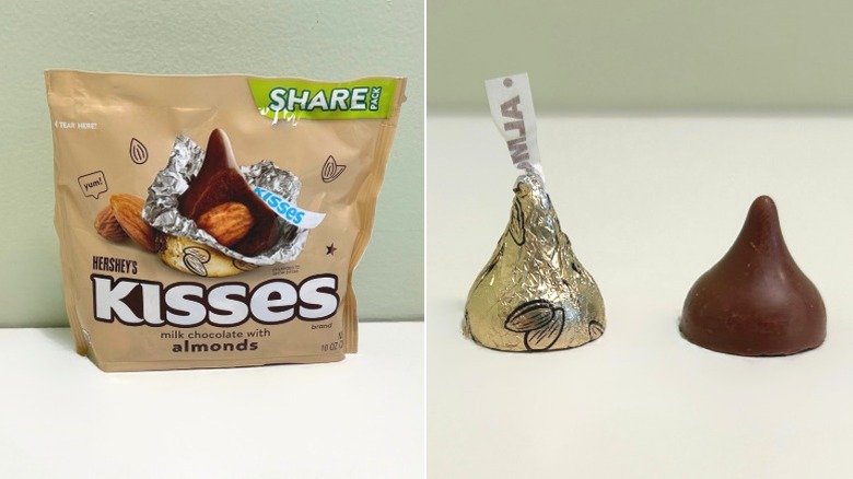 A bag of Hershey's Kisses Milk Chocolate with Almonds beside two kisses, one wrapped and one unwrapped