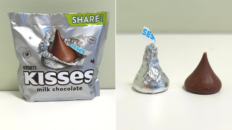 A bag of Hershey's Kisses Milk Chocolate beside two kisses, one wrapped and one unwrapped