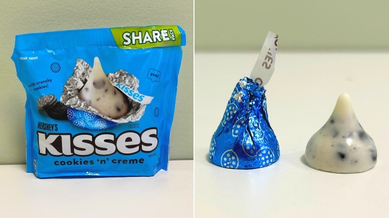 A bag of Hershey's Kisses Cookies n Creme beside two kisses, one wrapped and one unwrapped