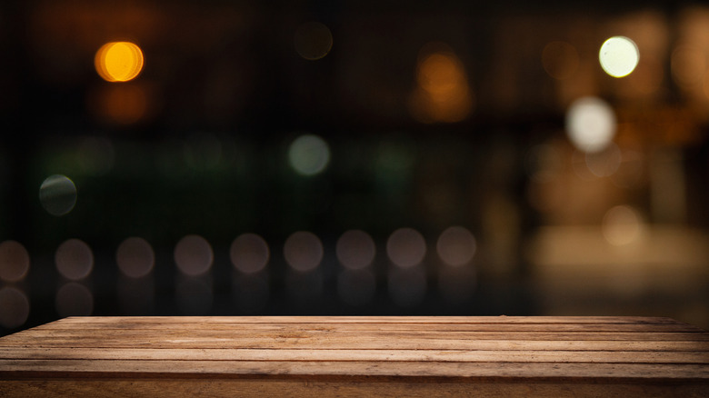 Wooden table in dark room