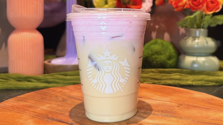 Starbucks' new Iced Cherry Chai with floral display