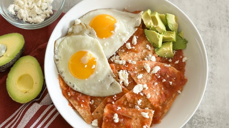 chilaquiles topped with avocado