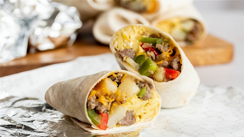 burrito halves in foil wrapper