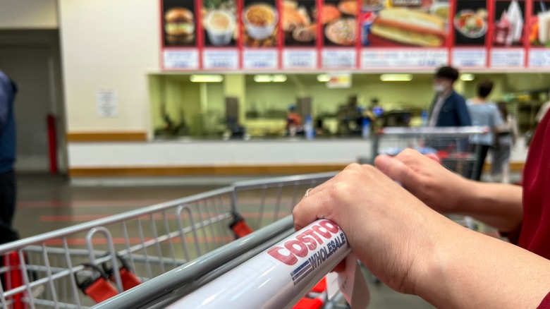 Costco shopping cart with shopper