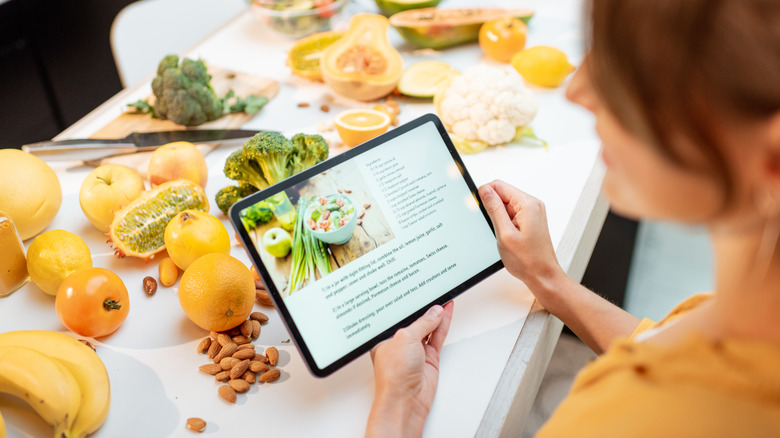 woman reading recipe on iPad