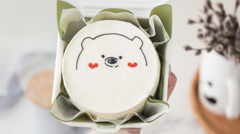 White bento cake with a simple bear design 