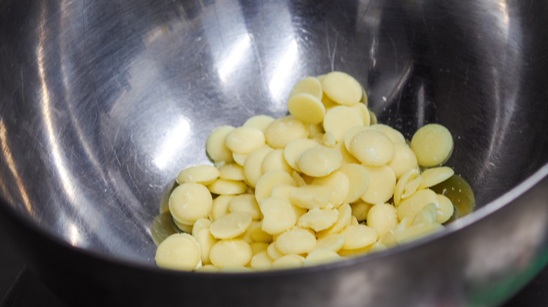 Metal bowl of white candy melts