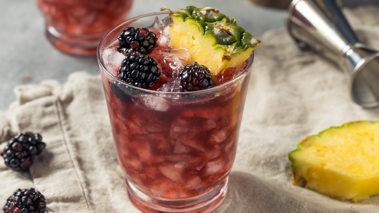 Crushed ice cocktail with blackberry and pineapple